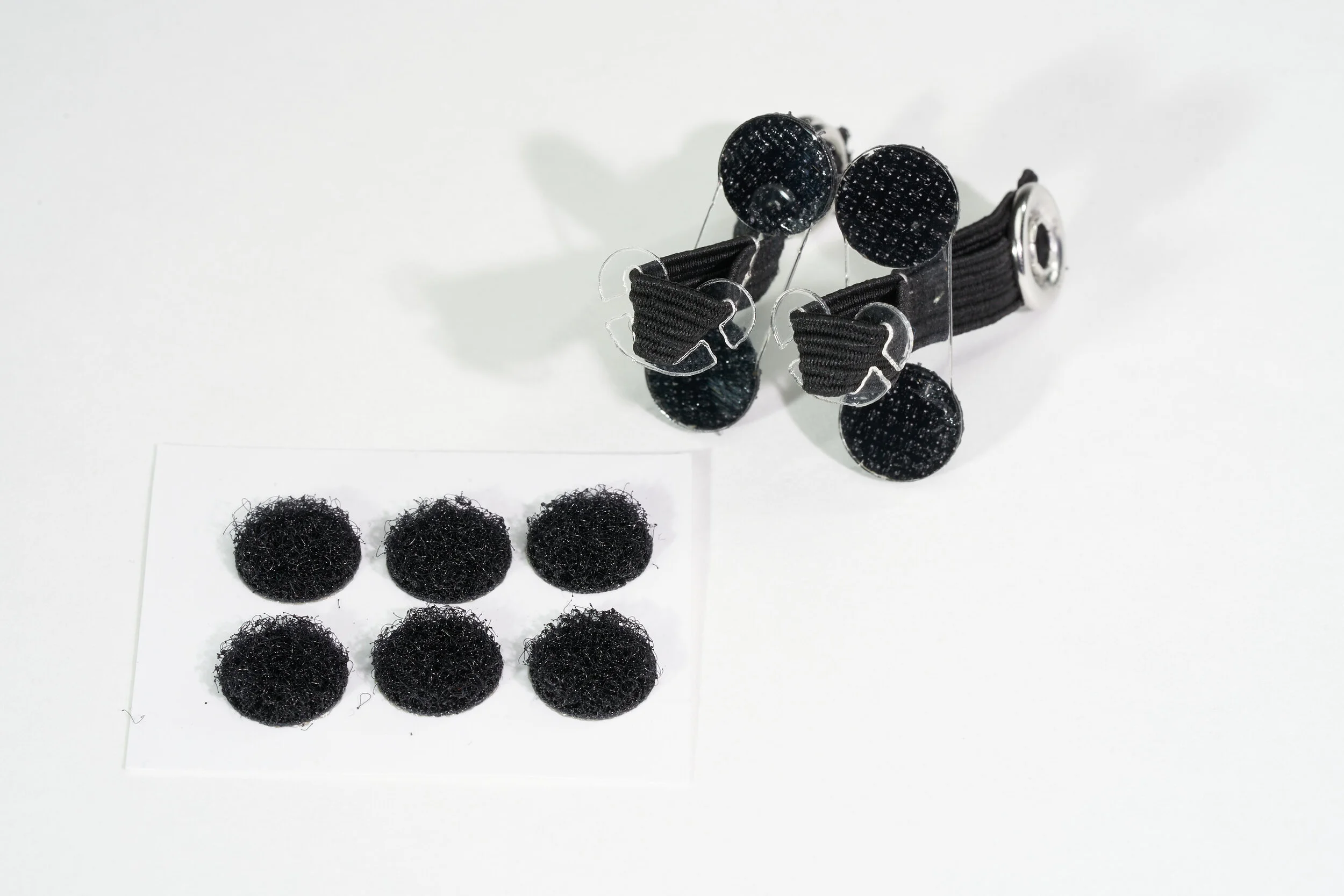 Comes with loop fastener dots for affixing to surfaces.