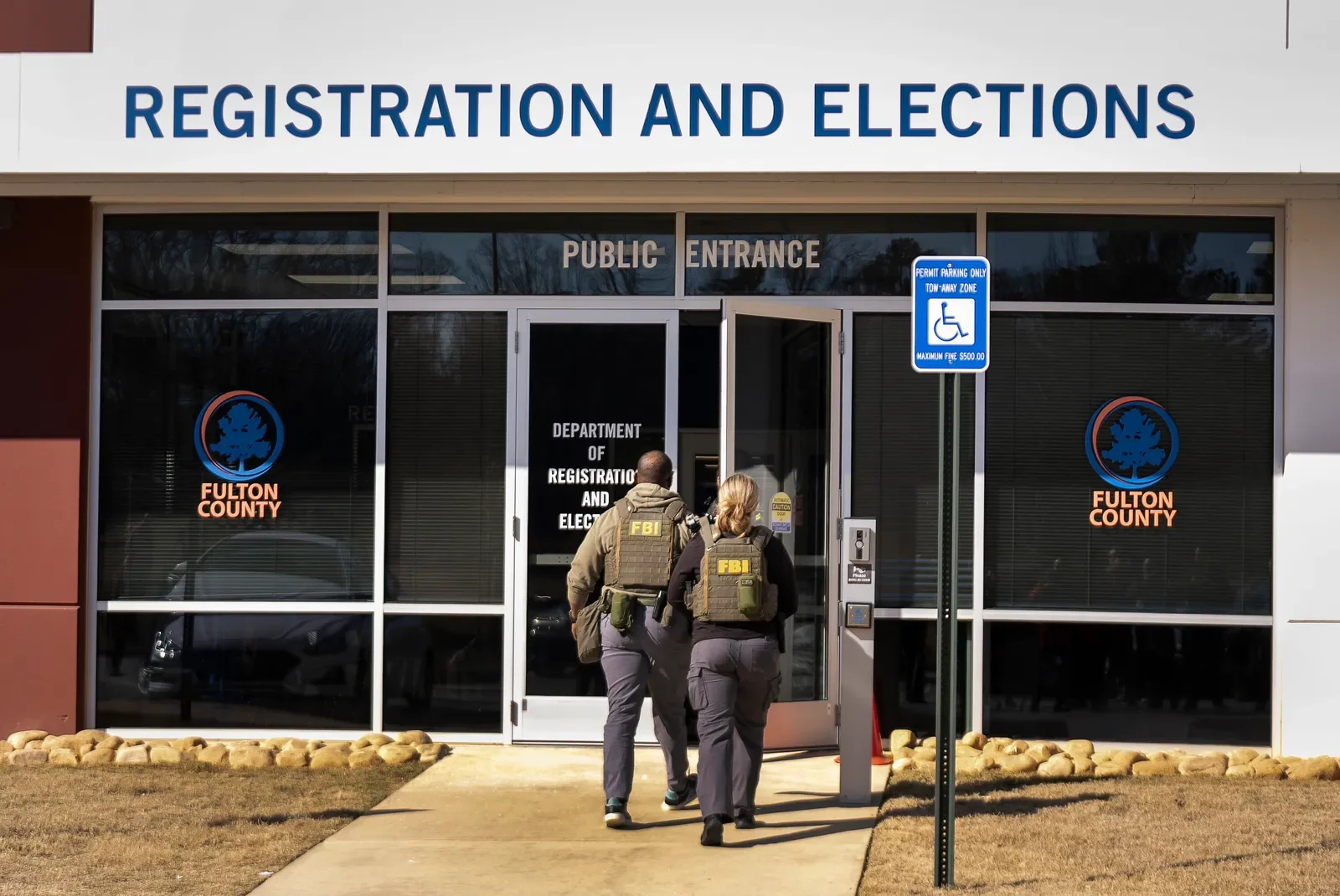 F.B.I. agents arrive to execute a search warrant at the Fulton County Election Hub and Operation Center, in Atlanta.