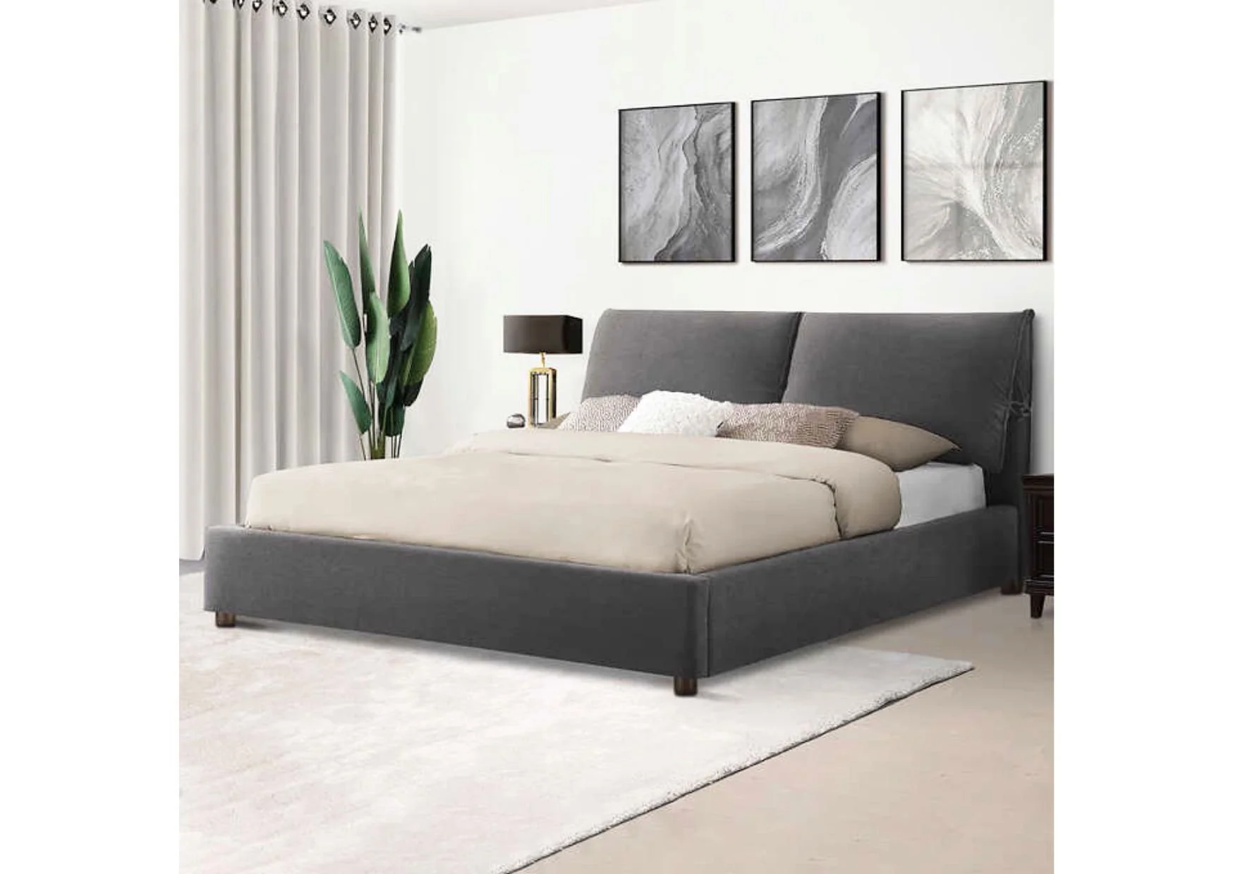 Grey Bed with Pillows Attached to Upholstered Headboard