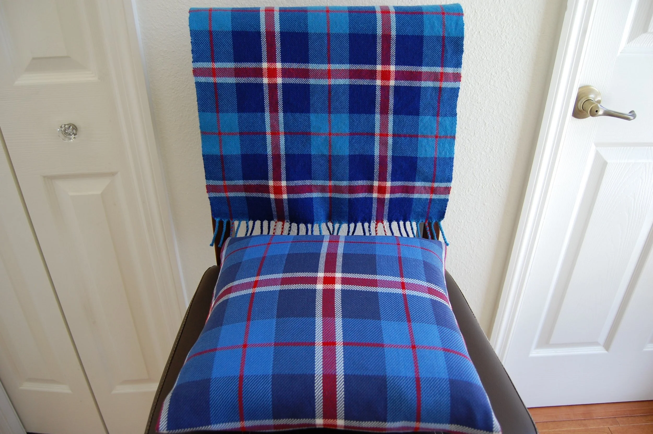 Lands of Liberty, in wool (scarf) and cotton (cushion) yarns.