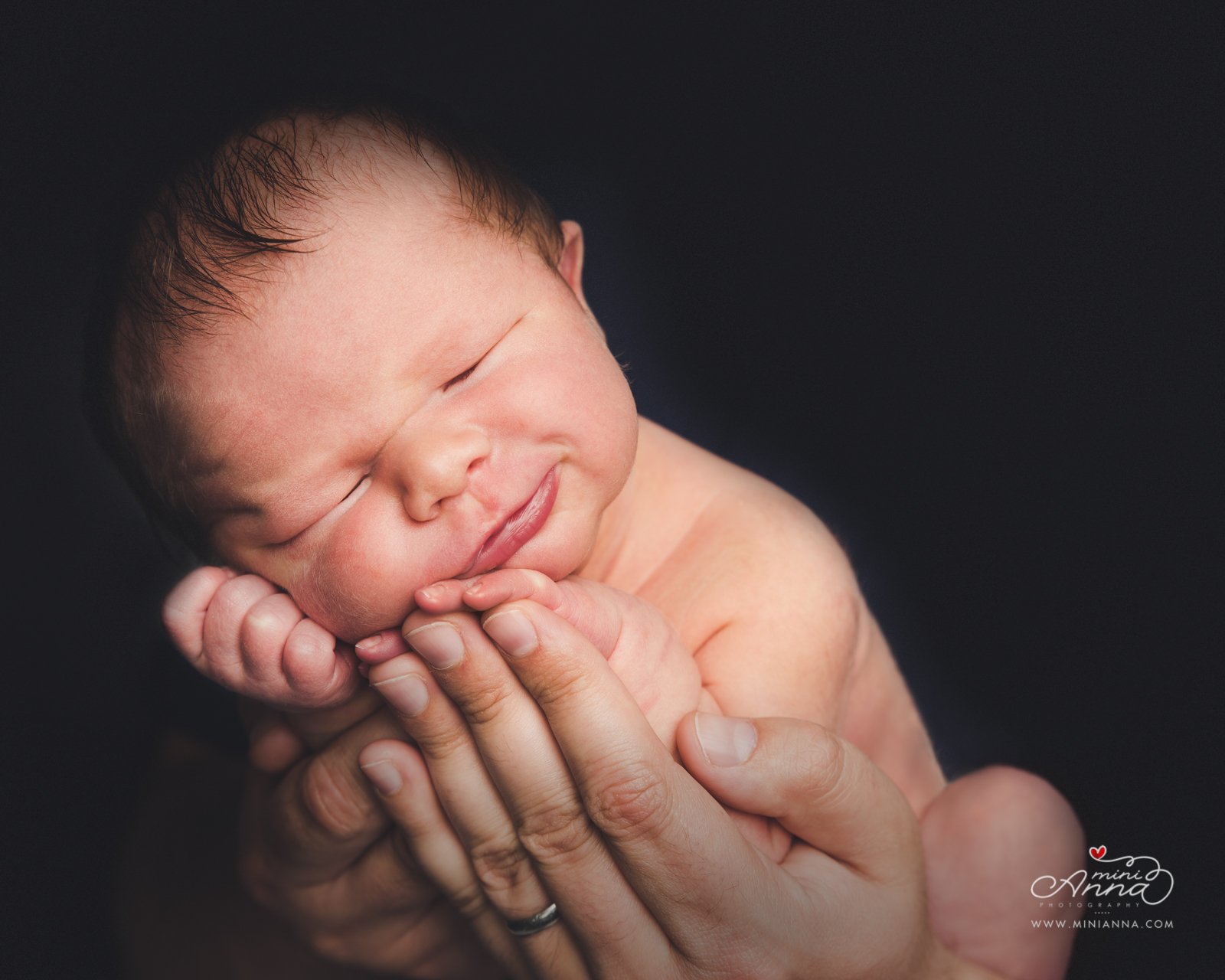 smiling newborn portrait