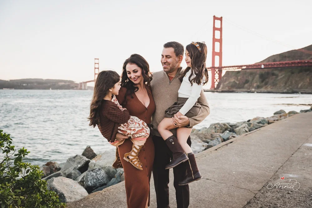 Family photo with Golden Gate Bridge in the background at Cavallo Point