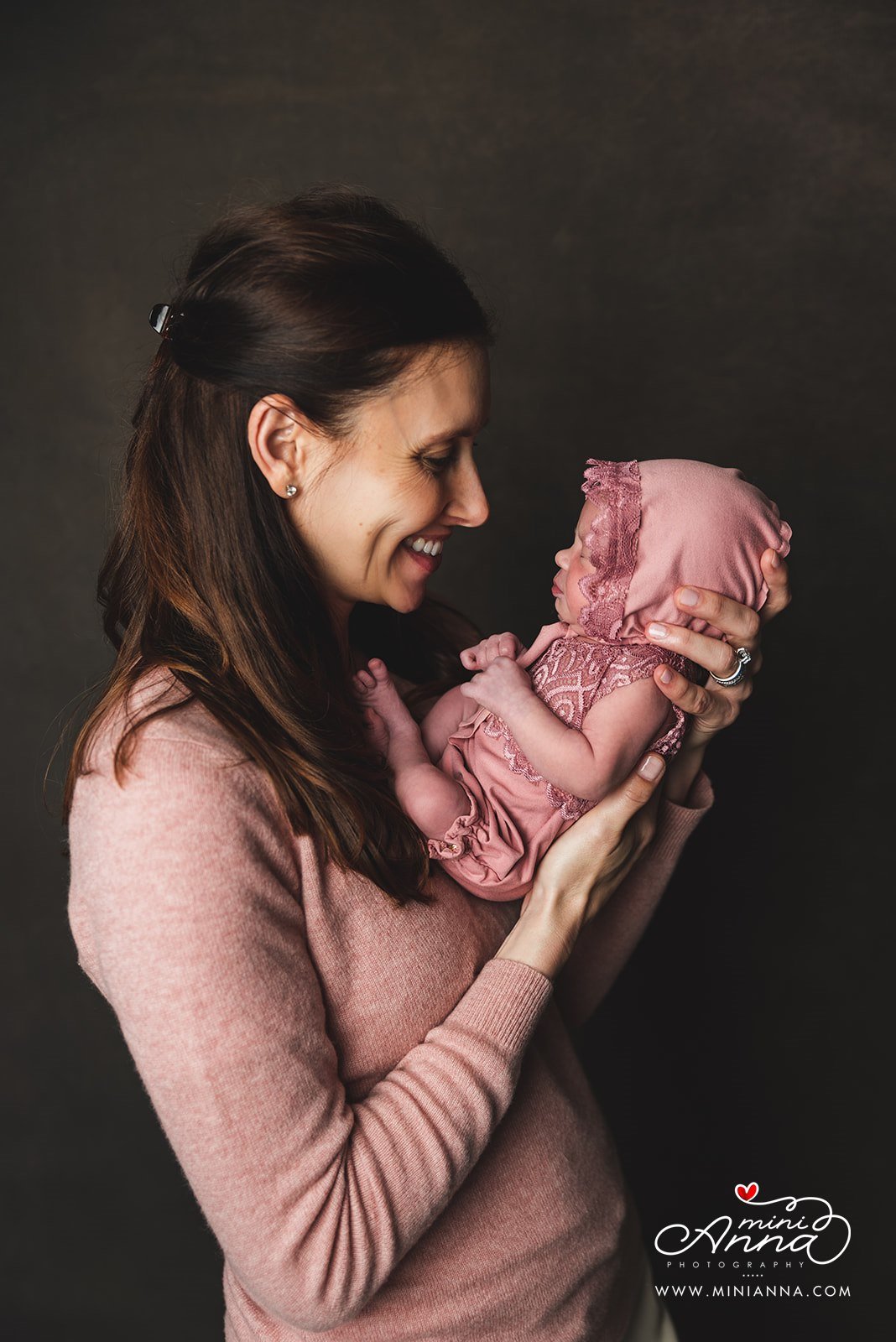 portrait of mom with baby girl