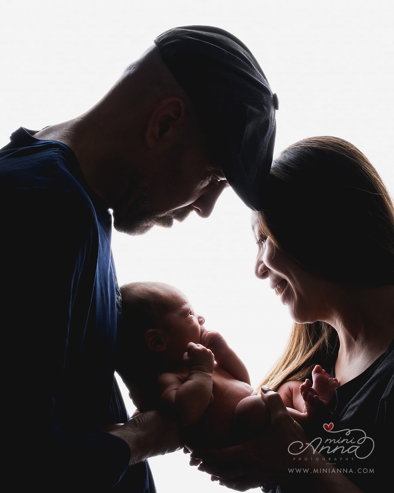 silhouette family portrait with baby