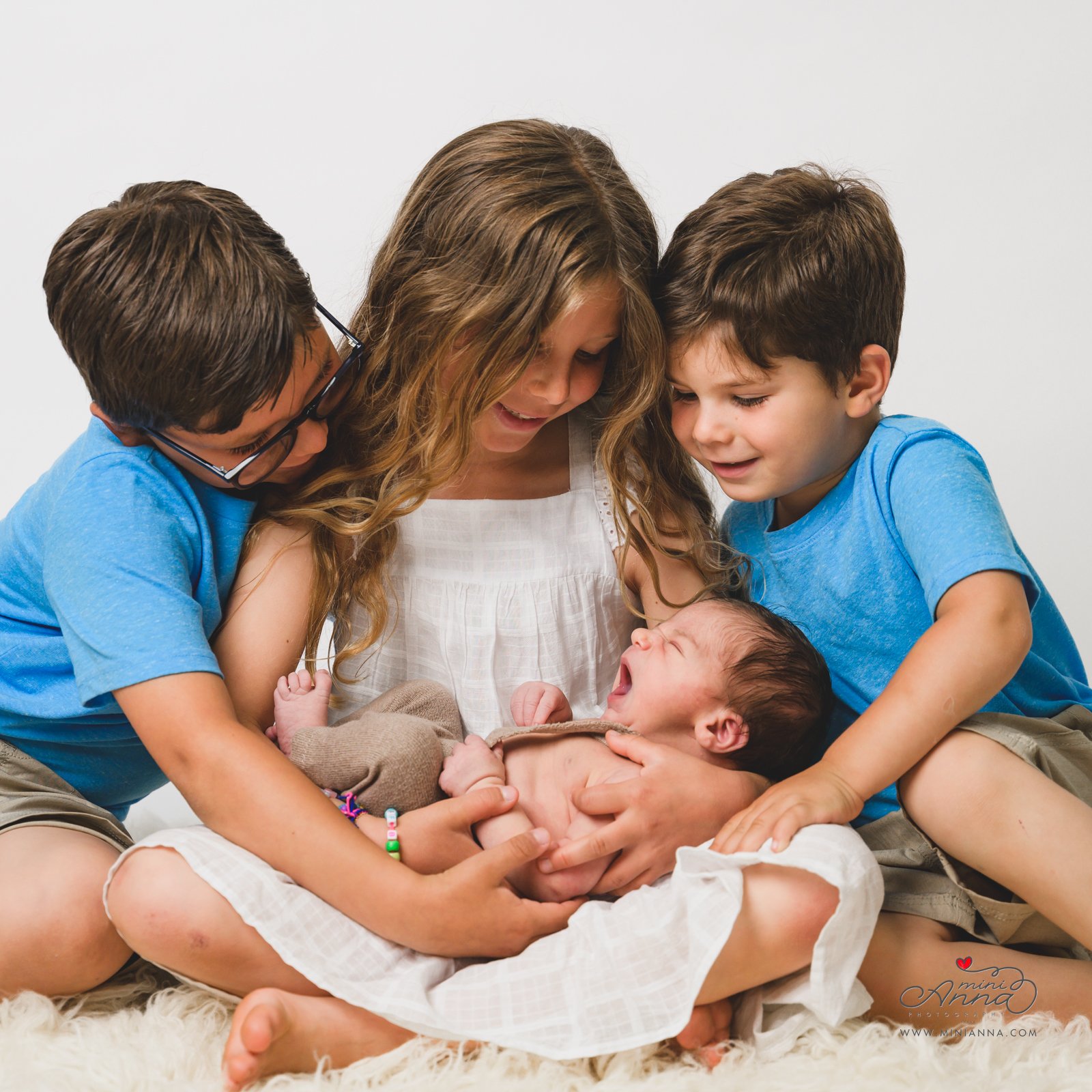 Newborn portrait with siblings