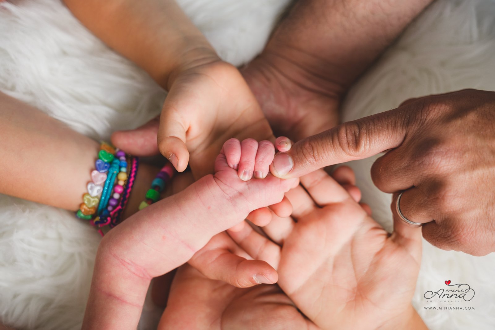 Baby and family hands