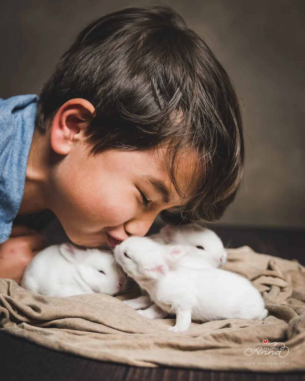 Kid kisses baby bunnies