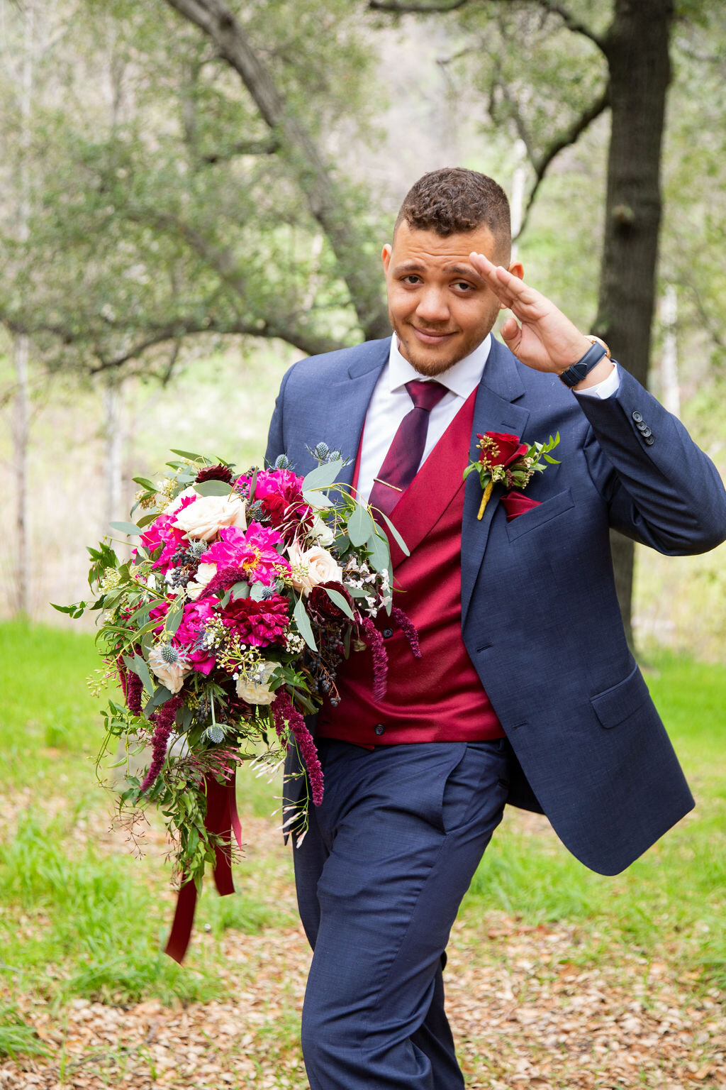 Groom holding wedding bouquet