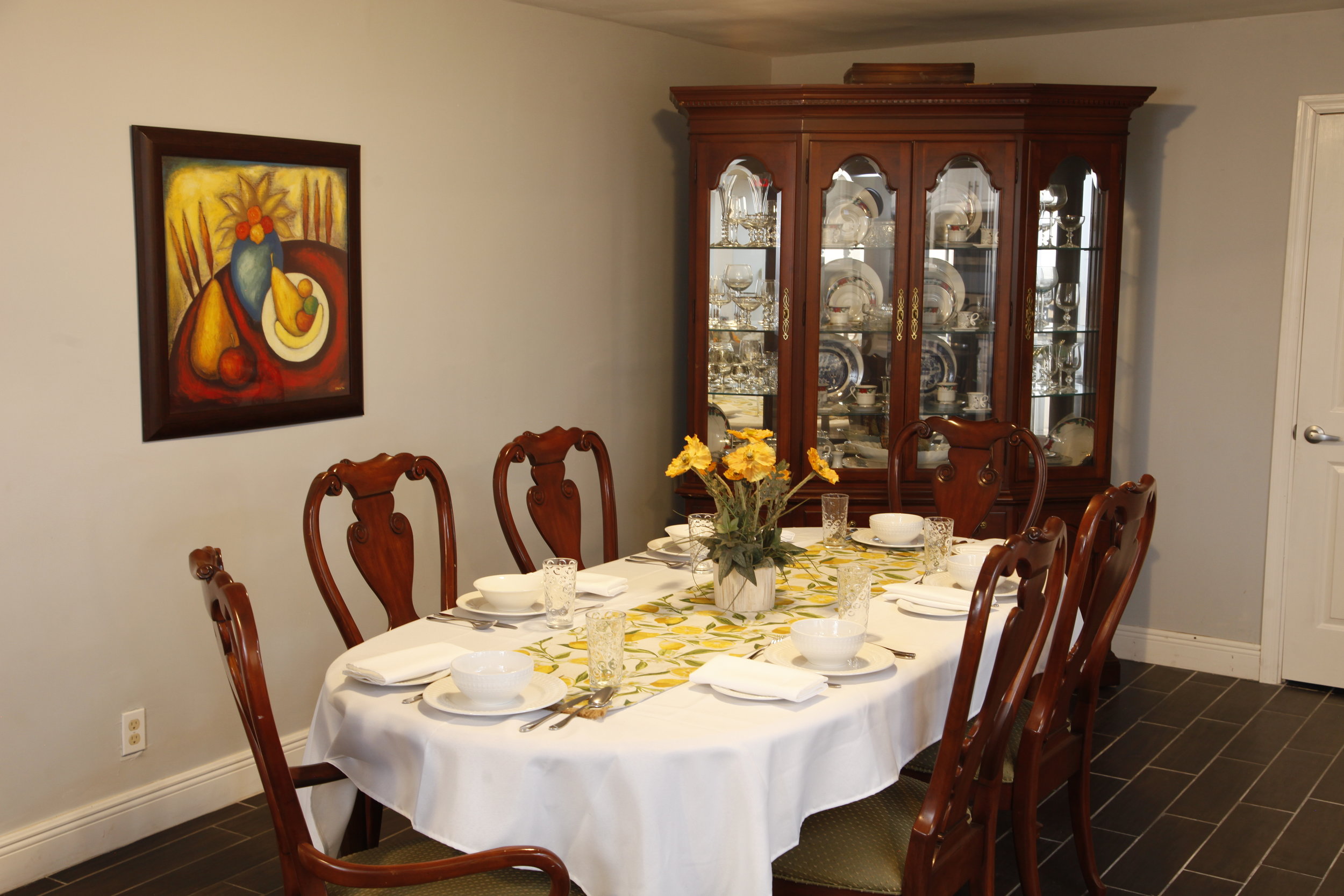  Our mahogany dining area seats all 6 residents, ensuring everyone can experience family dining at the Pearl House! 