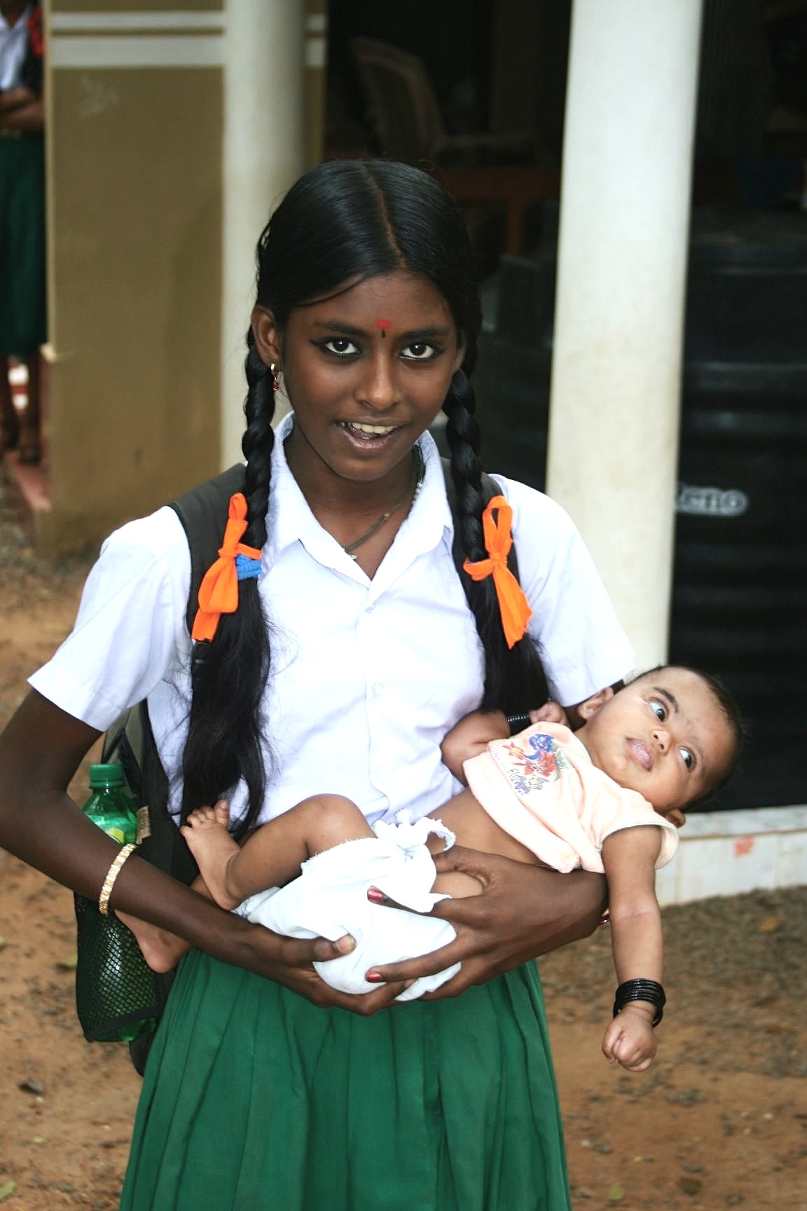 Girl with child, Kerala, India