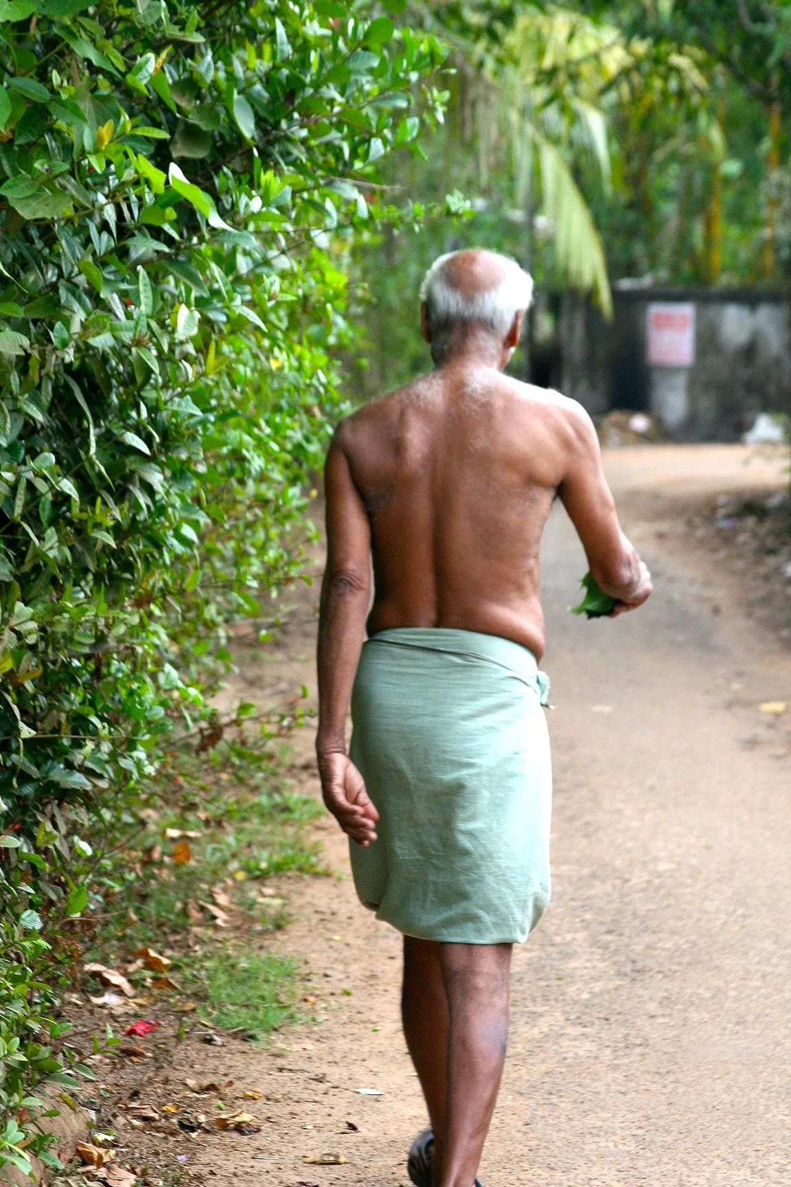 Man going to bathe in Kerala, India