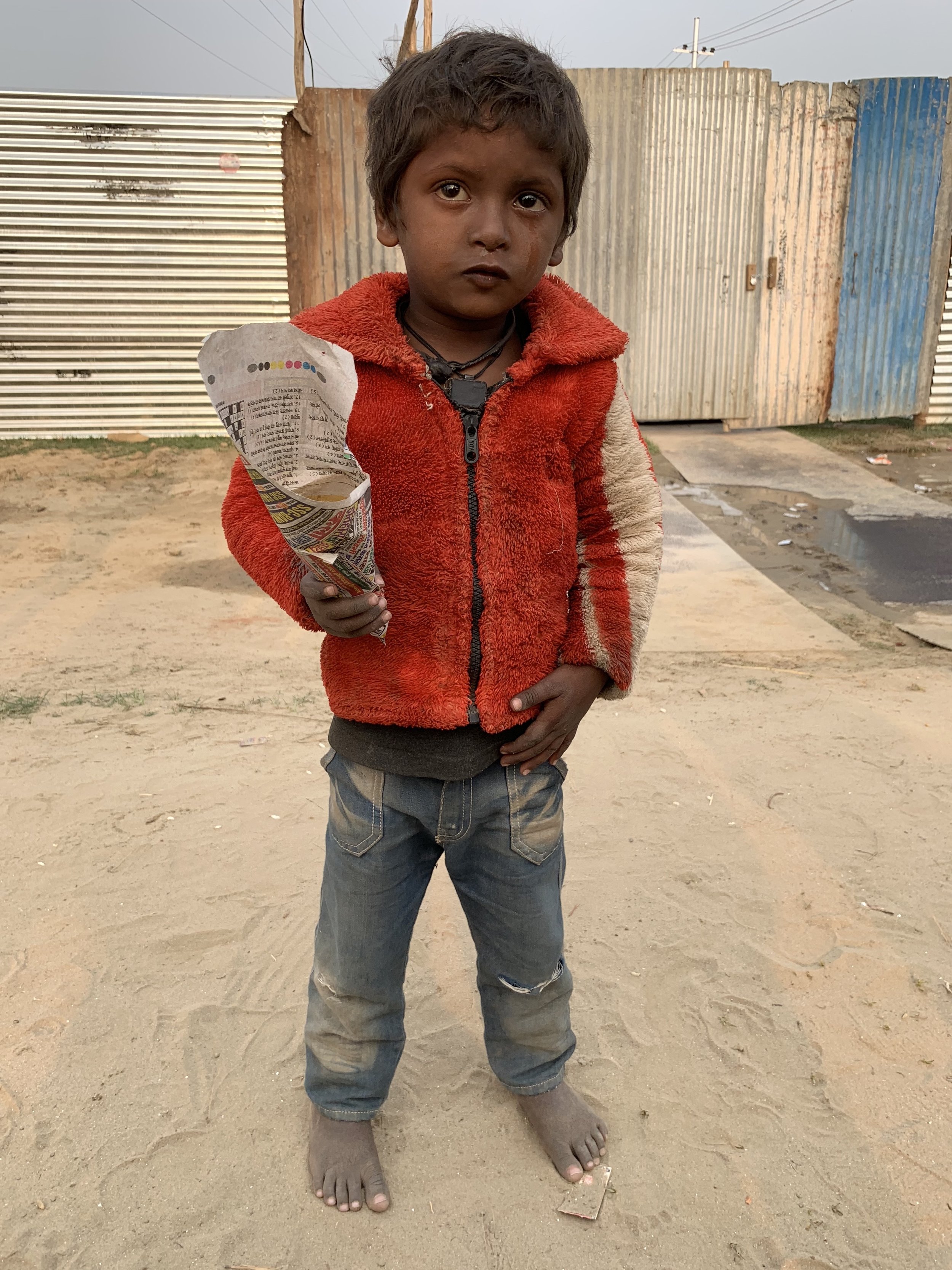 Small boy in the Tent City, Prayagra, India