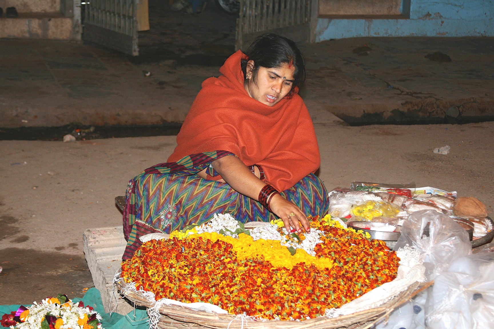 Garland maker at the ghats, Varanasi, India