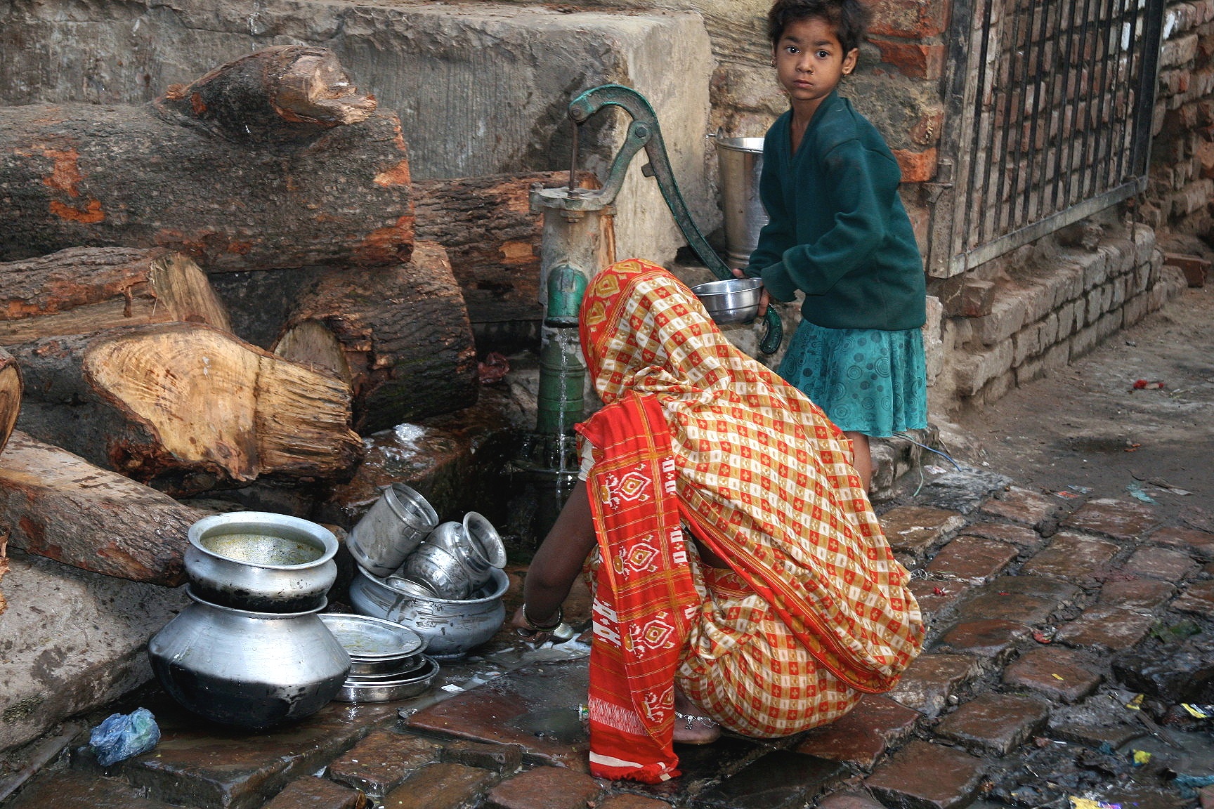Washing dishes in Varanasi, India
