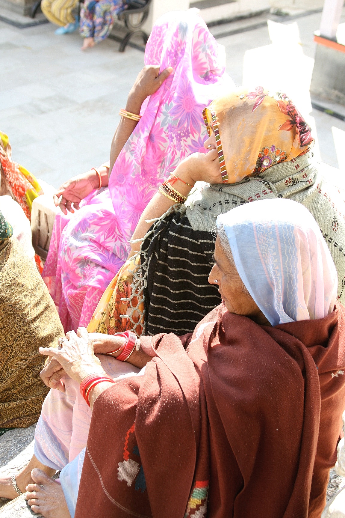 Women outside temple, Udaipur, India