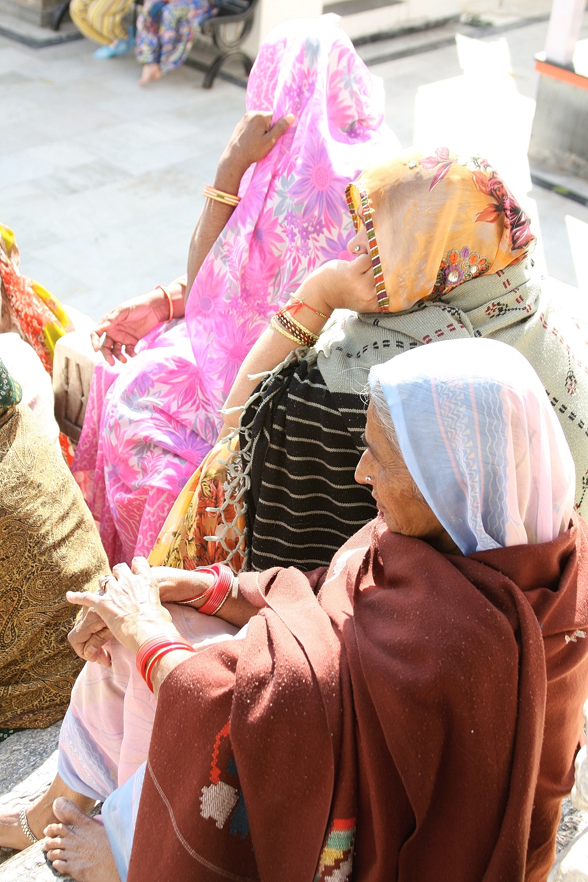 Women outside temple, Udaipur, India