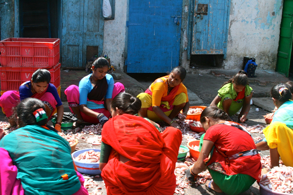 Women cleaning fish in Kumarakom, India