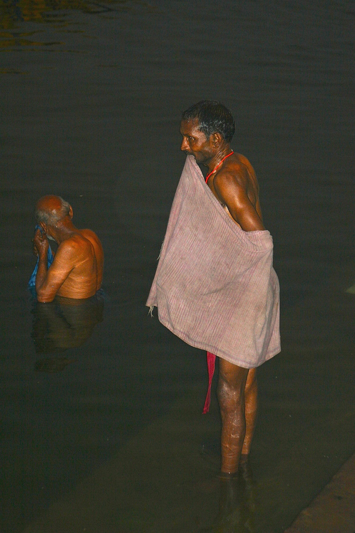 Bathing at sunset, Ganges River, Varanasi, India