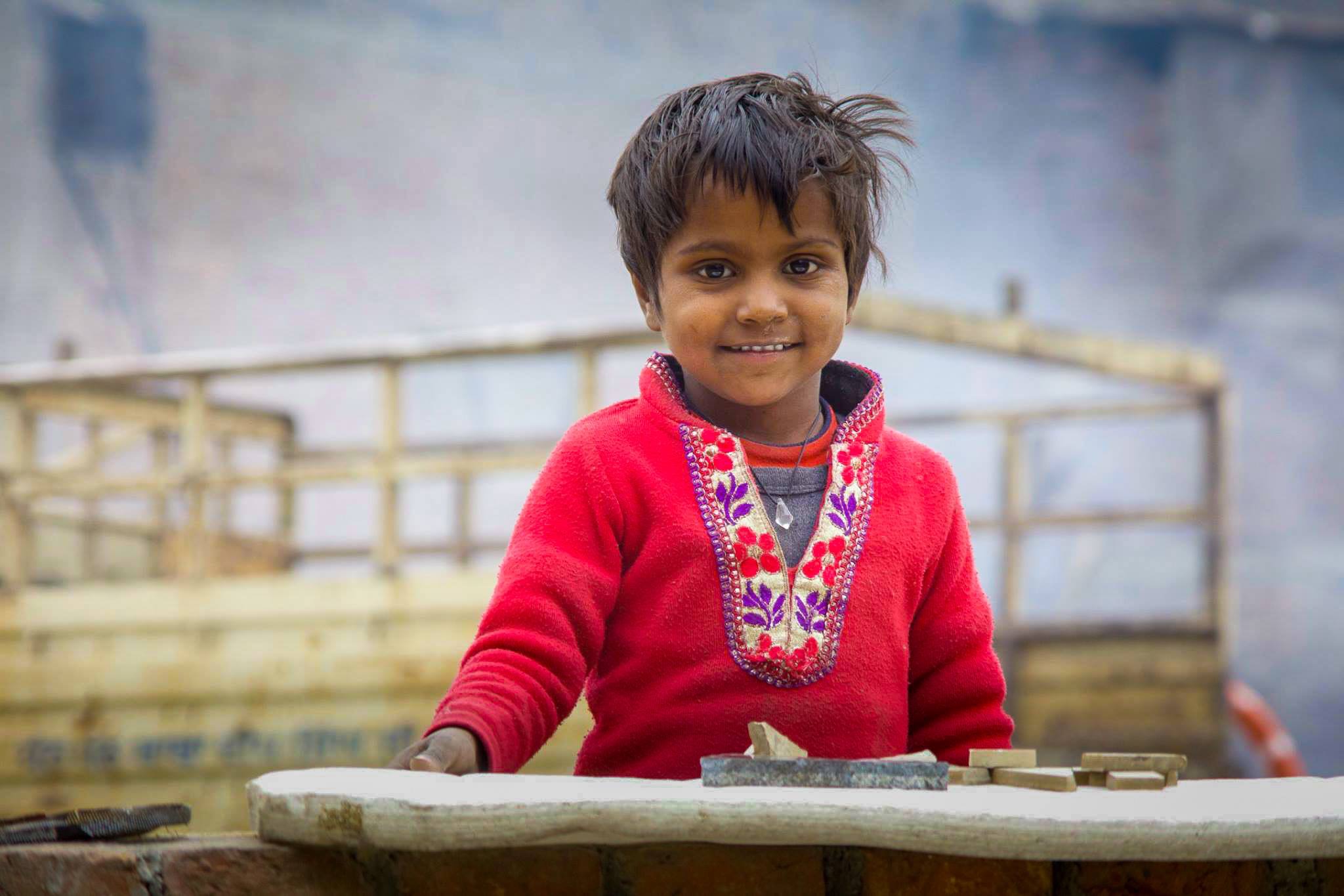 Small child at abandoned construction site, Amritsar, India