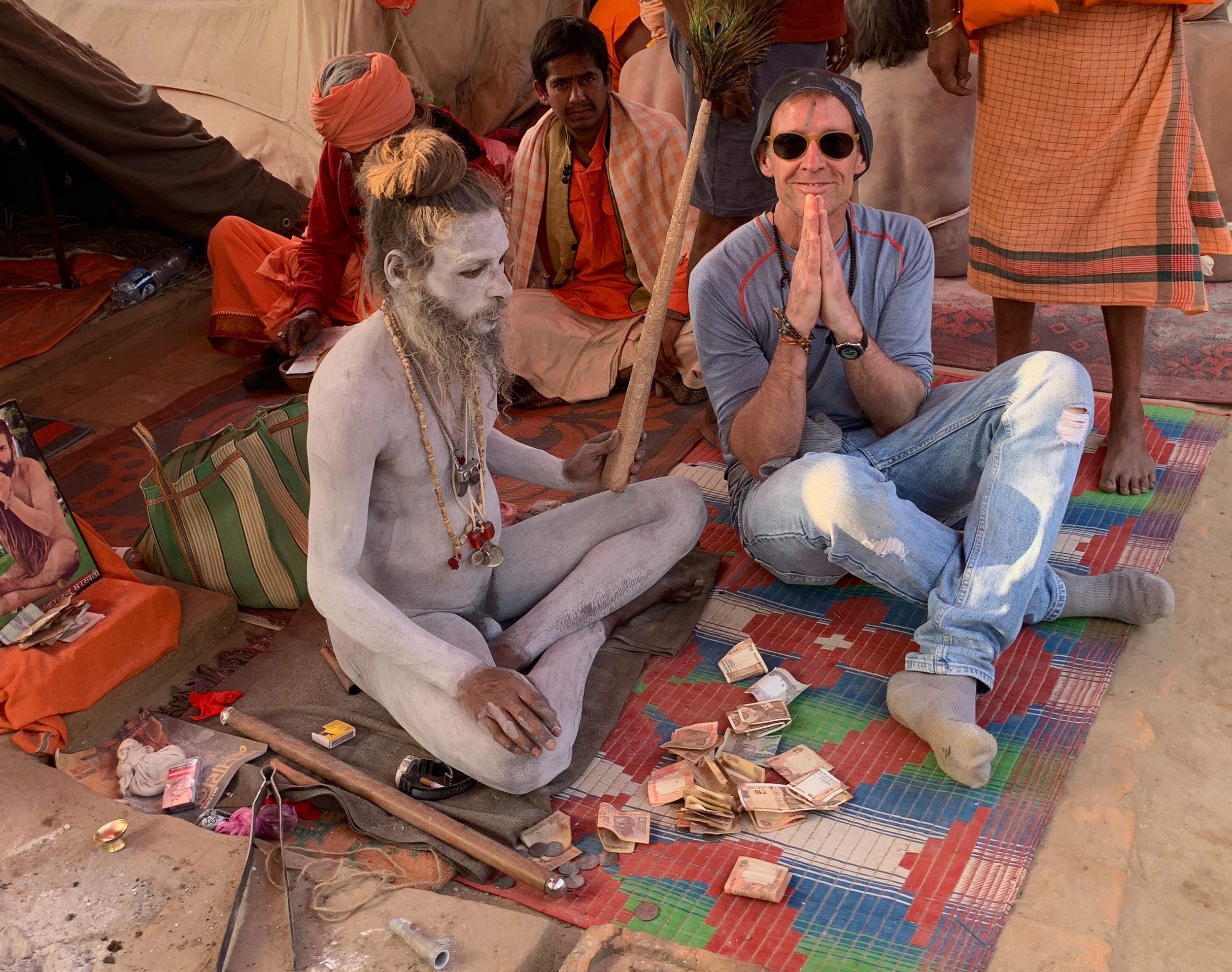 Receiving a blessing from a Sadhu, Juna Akhara Camp, Kumbh Mela, Prayagraj, India