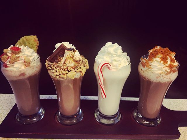 Hot cocoa flights because we are feeling ultra festive this weekend! From left, chocolate Christmas sugar cookie; s&rsquo;mores; peppermint white chocolate; gingerbread!