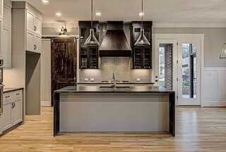 Honed Black Soapstone gives this kitchen a texture and vibe that makes you want to spend more time in the kitchen. The island has waterfall legs for added dimension. This beautiful home is just one of the unique ways you can make your home special.  