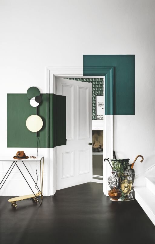 A room can’t go wrong with a pristine white canvas, but adding a bold color like these shades of green brings in a sense of edginess. Source Link