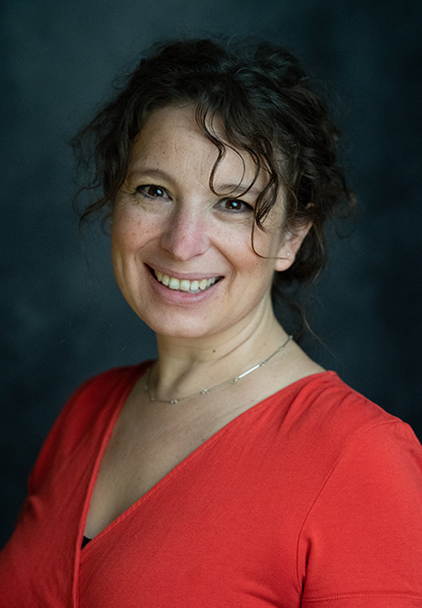 Professional headshot of woman in Bristol studio