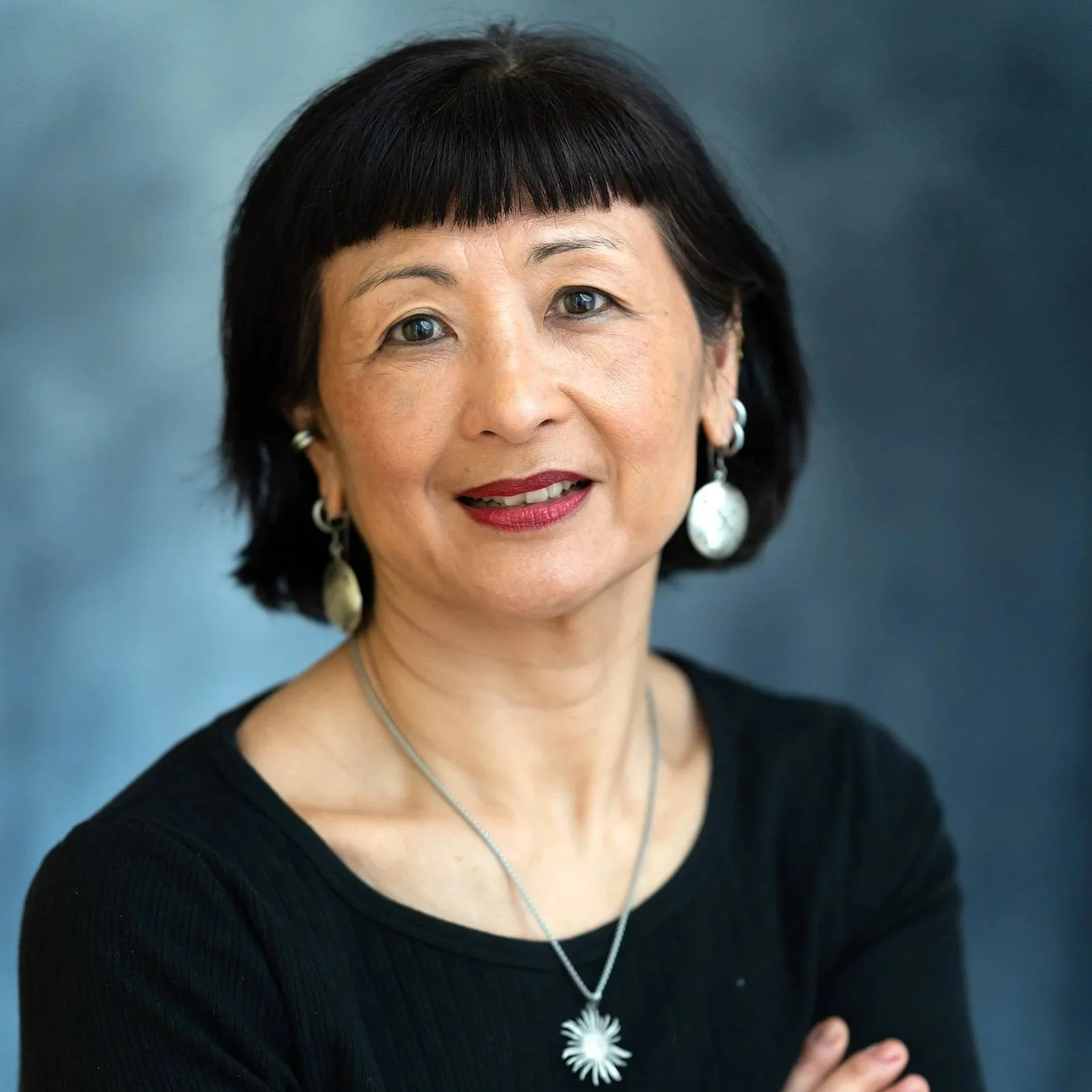 Professional headshot of women in black outfit in Bristol studio.