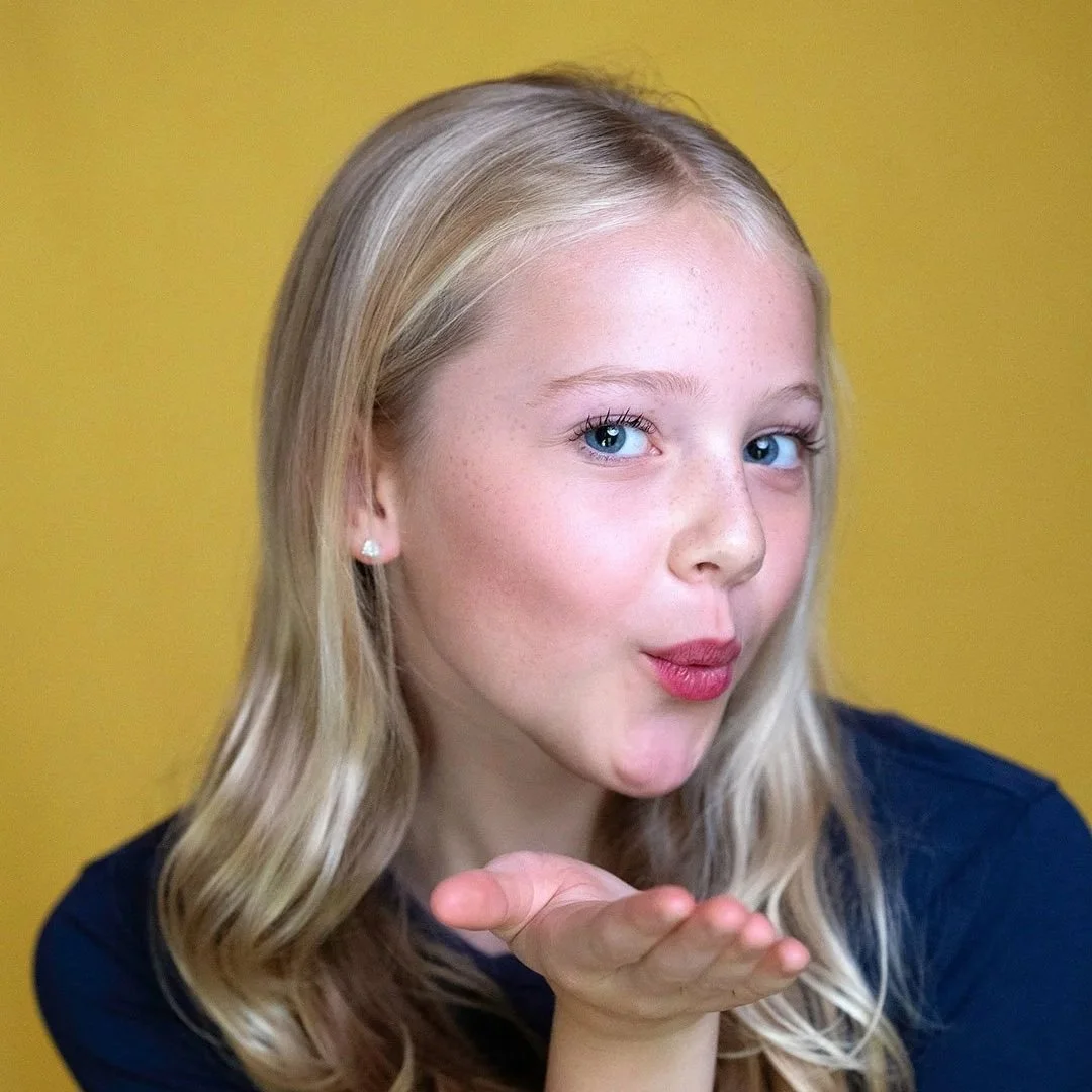 Actor headshot of young women on yellow background in Bristol.