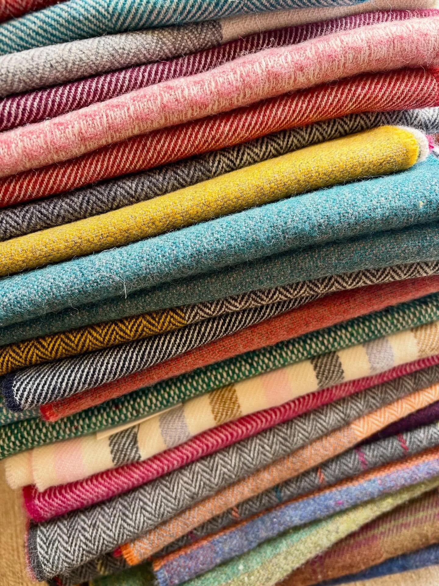 Back in stock: cozy merino scarves, some of which are made with recycled wool.