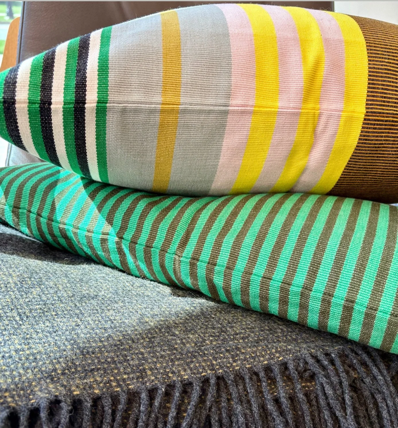 Two cushions and a throw series. New arrivals for fall living: autumn palette with a pop a happy colour!