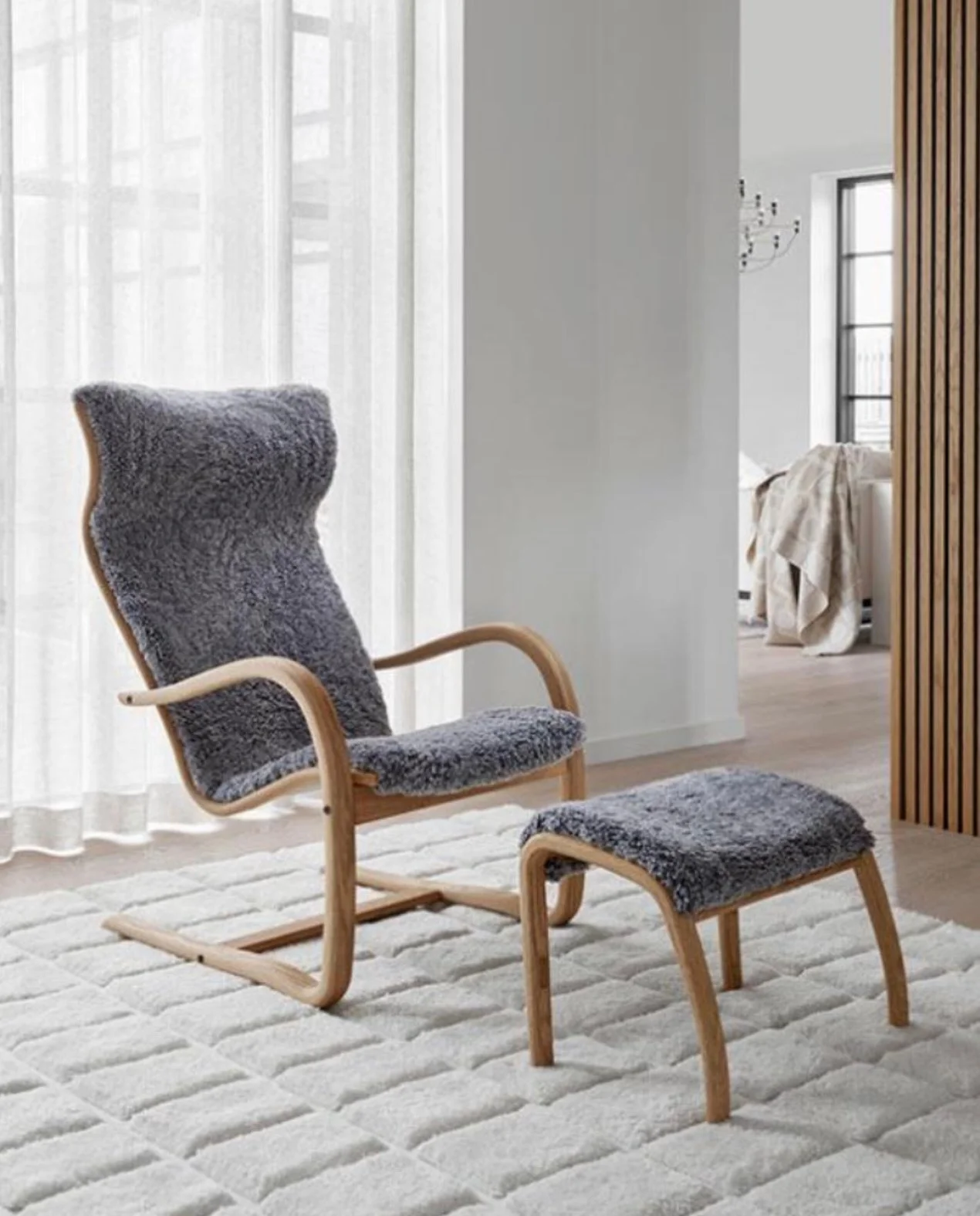Cozy, cozy sheepskin covered armchair and footstool!