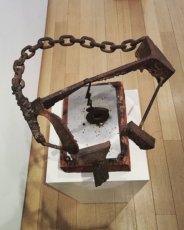 Mark di Suvero raises the the tradition of welded sculpture to the scale of architecture! This small work from 1962 is made from a found chain, welded to maintain structure and is properly poised on a thin vertical rod. When touched the upper piece t