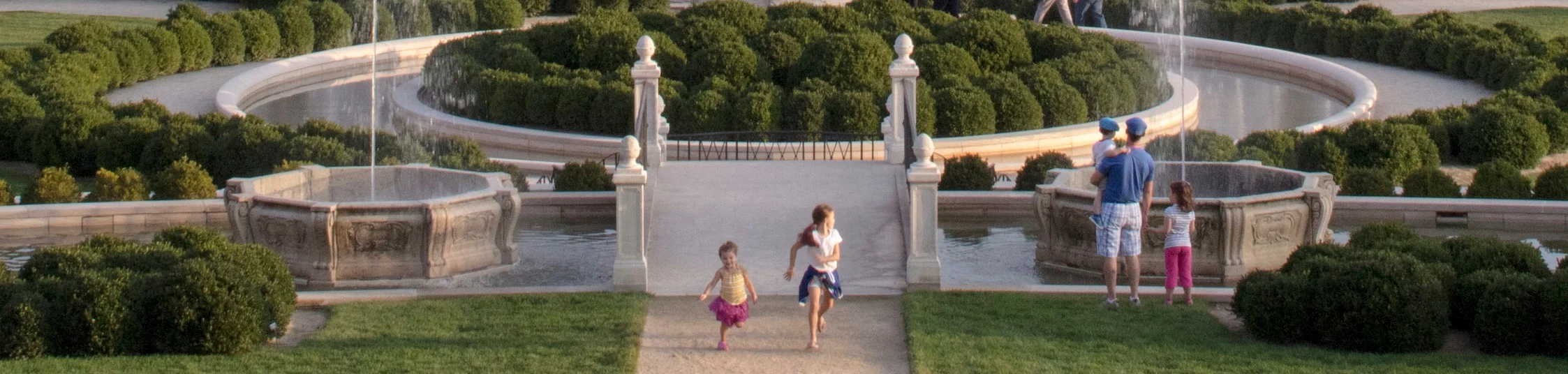 Children and families experiencing the gardens and spraying fountains at Longwood Gardens, PA. Photo: Daniel Traubl.