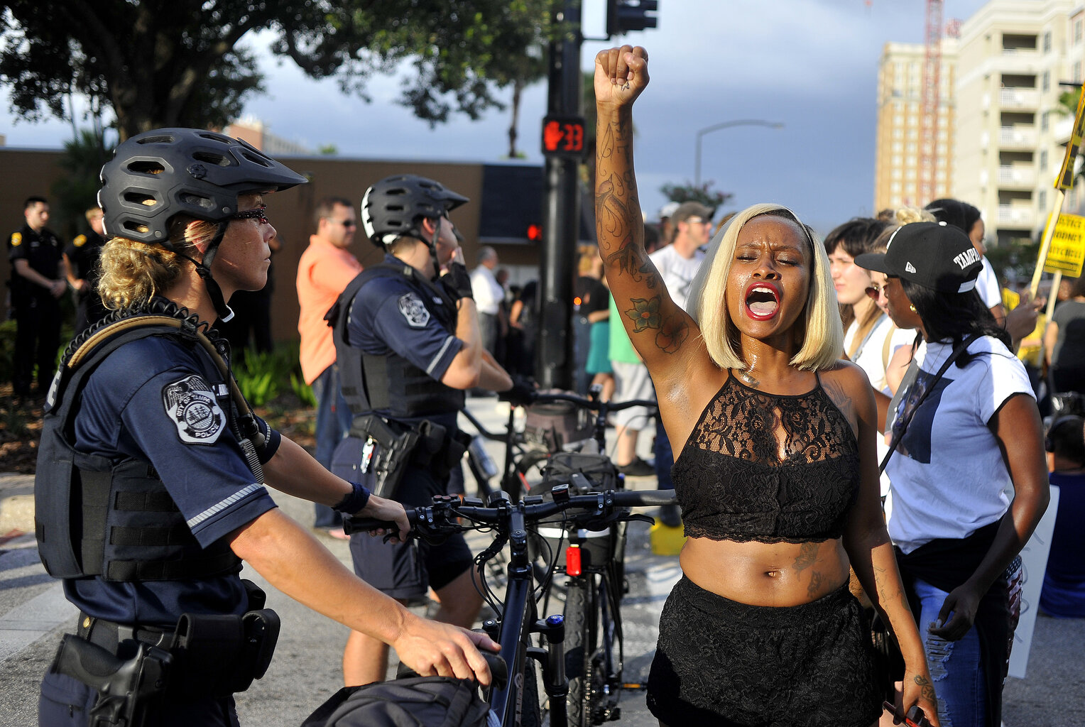  Loneisha Marchman, 25, chants "Hands up, Don't shoot" towards the Tampa Police Department while the Black Lives Matter protesters block Ashley Drive. The Black Lives Matter movement march through downtown Tampa starting from Lykes Gaslight Park on M
