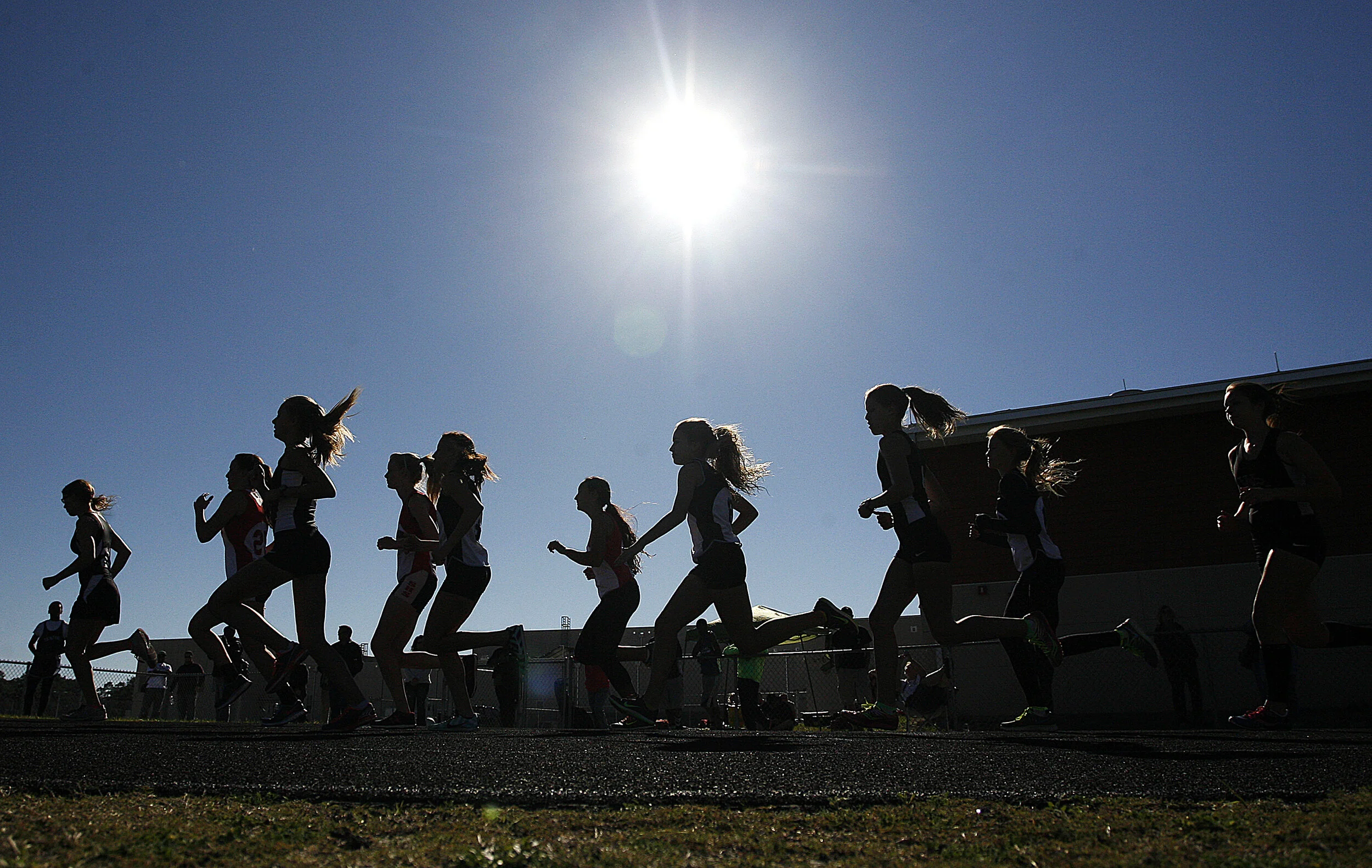  Girls representing High Schools from Pasco, Hernando and Citrus Counties compete in the Varsity 1600 Meter Run during the Kiwanis Invitational at Weeki Wachee High School on March 13, 2014.  
