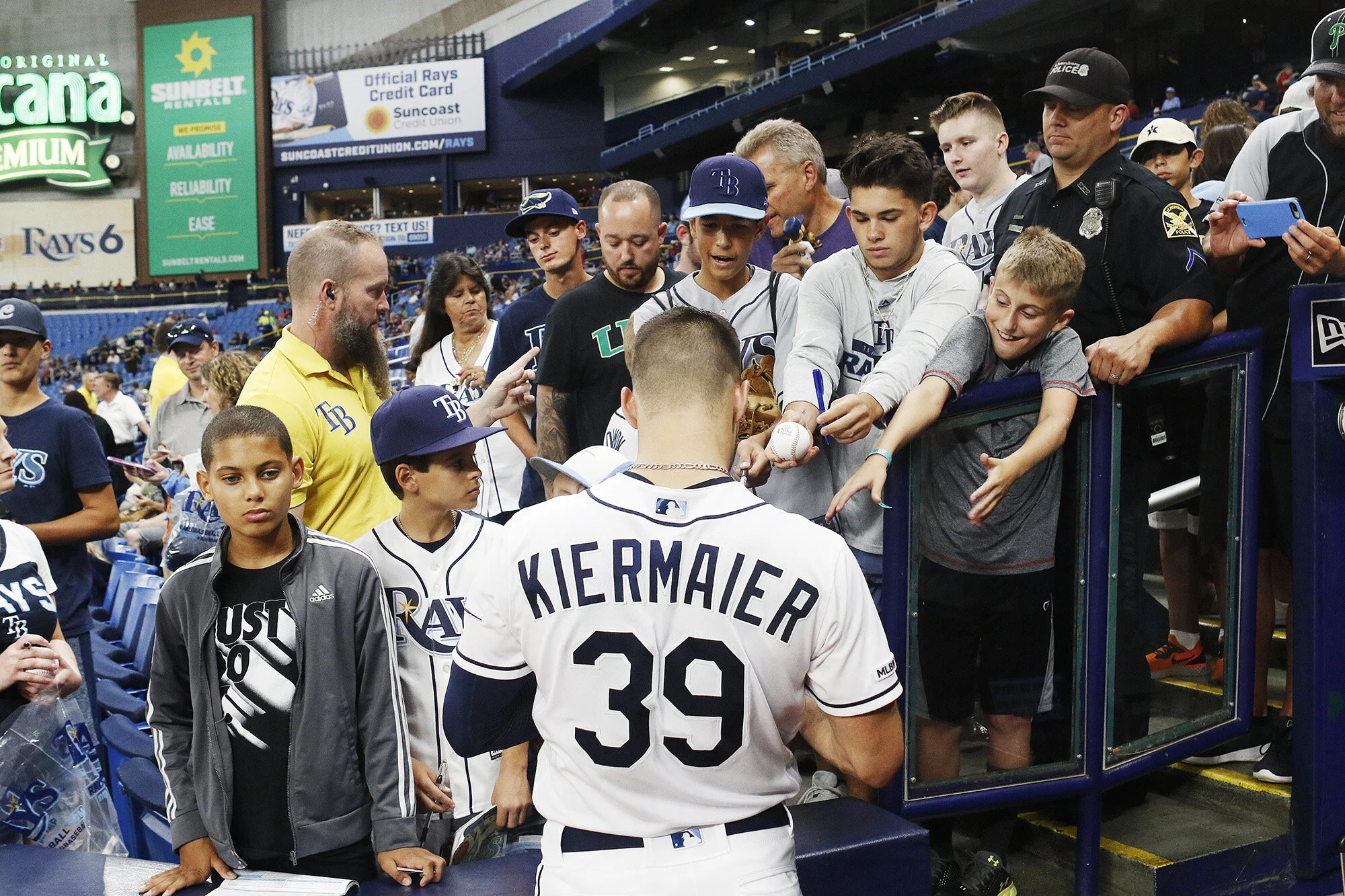  Tampa Bay Rays center fielder Kevin Kiermaier (39) signs autographs for fans before the game the Detroit Tigers at Tropicana Field in St. Petersburg, Florida on Friday, August 16, 2019. 