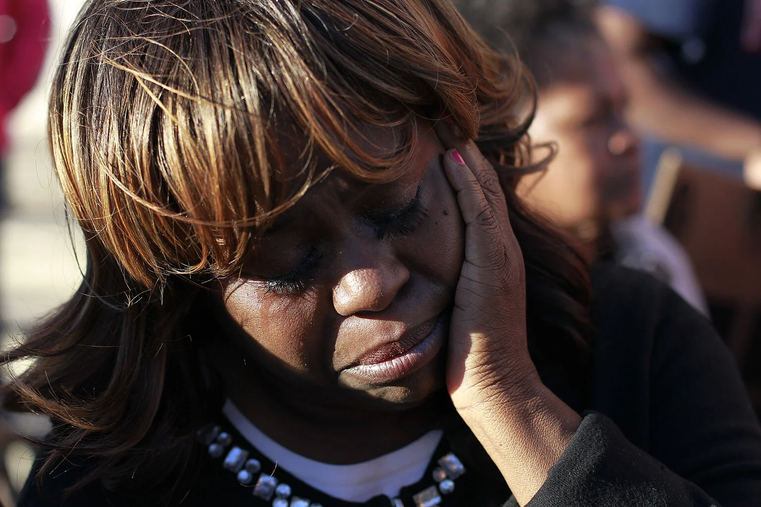  Denise Hunt of Jacksonville weeps as she hears news about the jury in Michael Dunn trial are deadlocked on the second degree murder charge while deliberating at the Duval County Courthouse in Jacksonville. Dunn was charged with second degree murder 