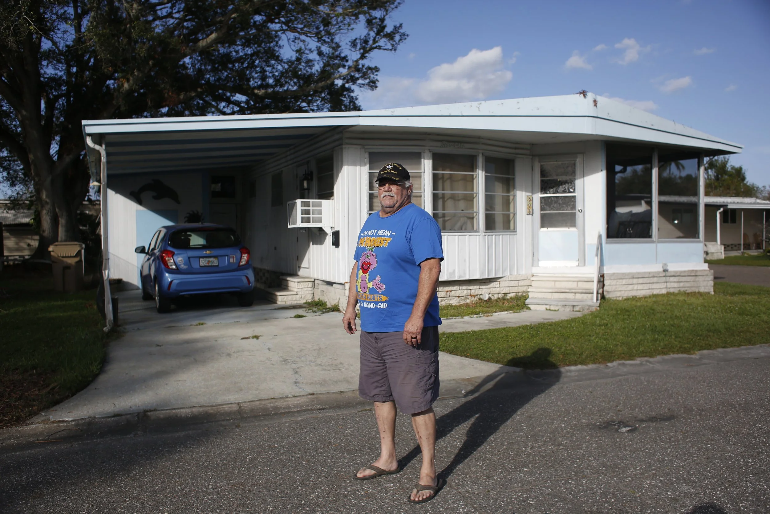 Daniel Clearwater stands in front of his home in Pinellas Park, Florida. Clearwater sold his home due to the rising lot rent in the Twin Palms manufactured. Octavio Jones for WUSF/Pulitzer Center