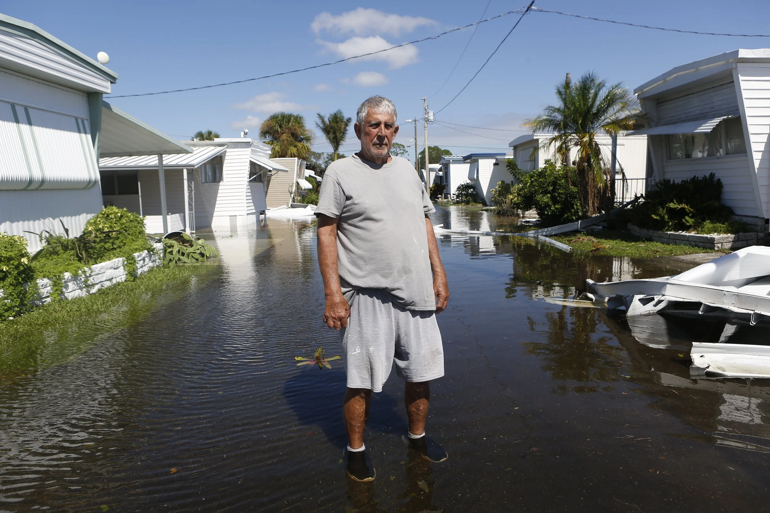 Gerald Gilchrist poses for a portrait while surrounded by floodwaters after Hurricane Milton made landfall in St. Petersburg, Florida, on October 10, 2024. REUTERS/Octavio Jones