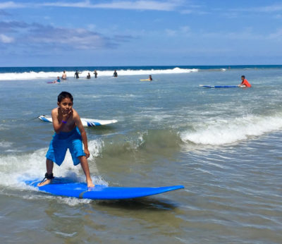 This boy from A Step Beyond surfs for the first time with style and confidence.