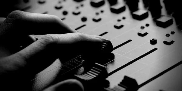 Sound-Design-Recording-Arts-BW_Hands-on-audio-mixer.jpg