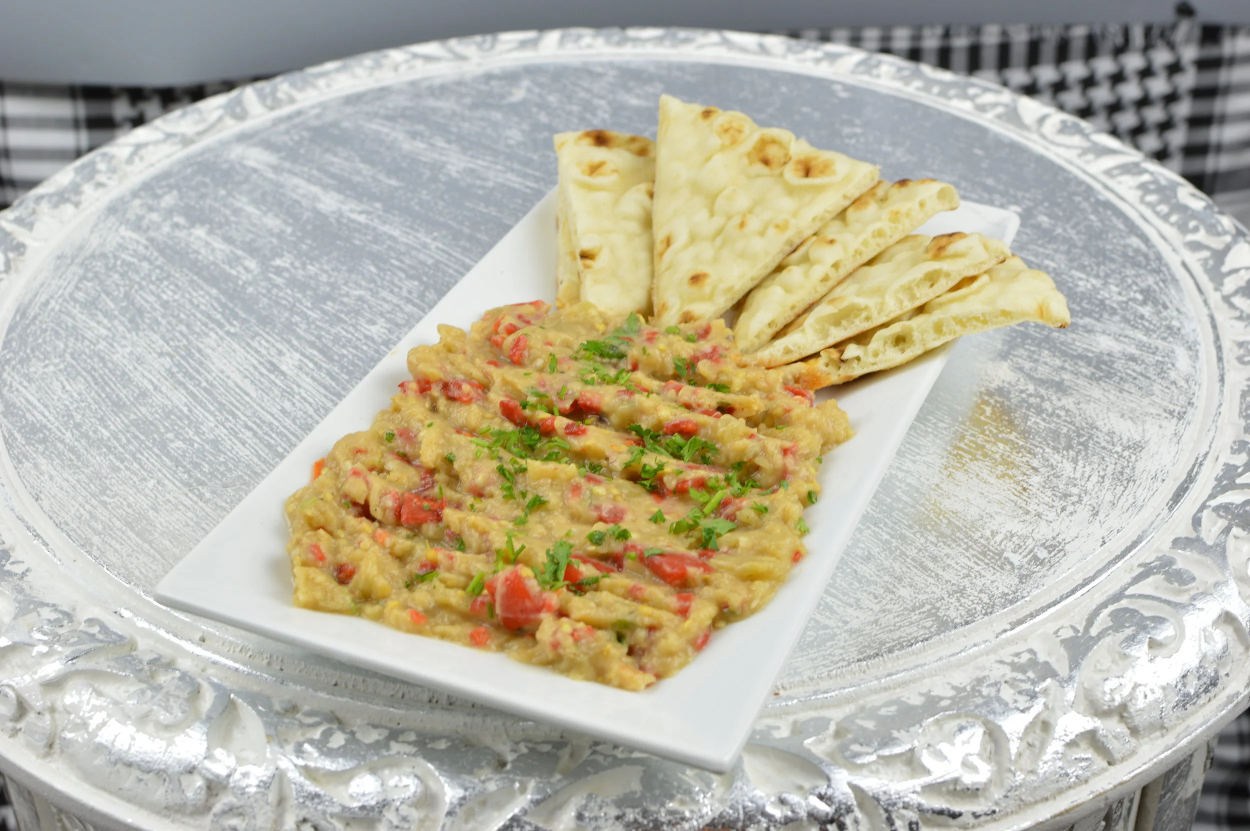 Patlican Ezmesi (Baba ghanoush) - Roasted fresh eggplants puree mixed with garlic and seasoned with fresh lemon juice, olive oil and salt. $5.95