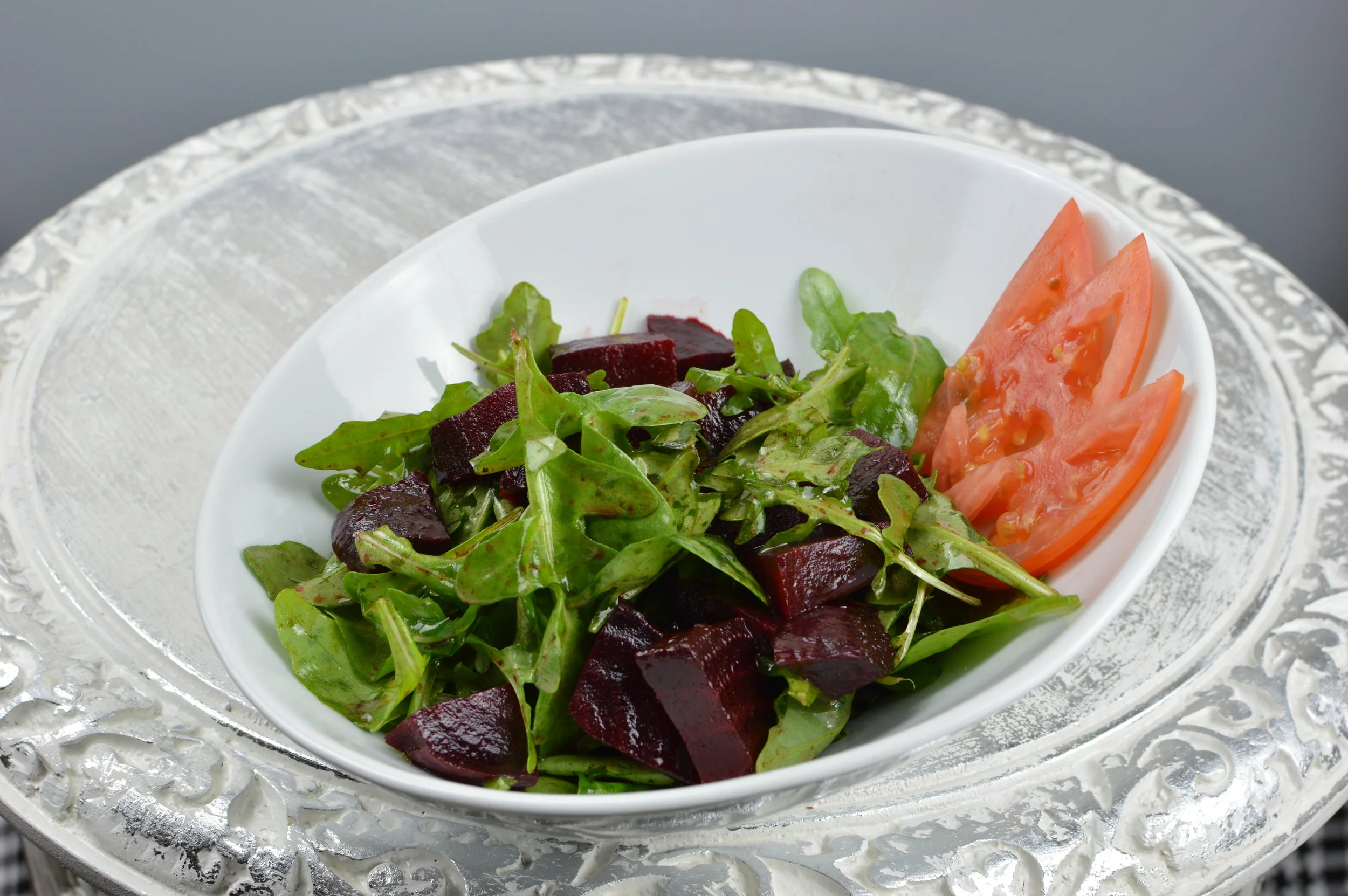 Beet Salad - Beets, arugula, tomato, feta cheese and choice of dressing. $6.95
