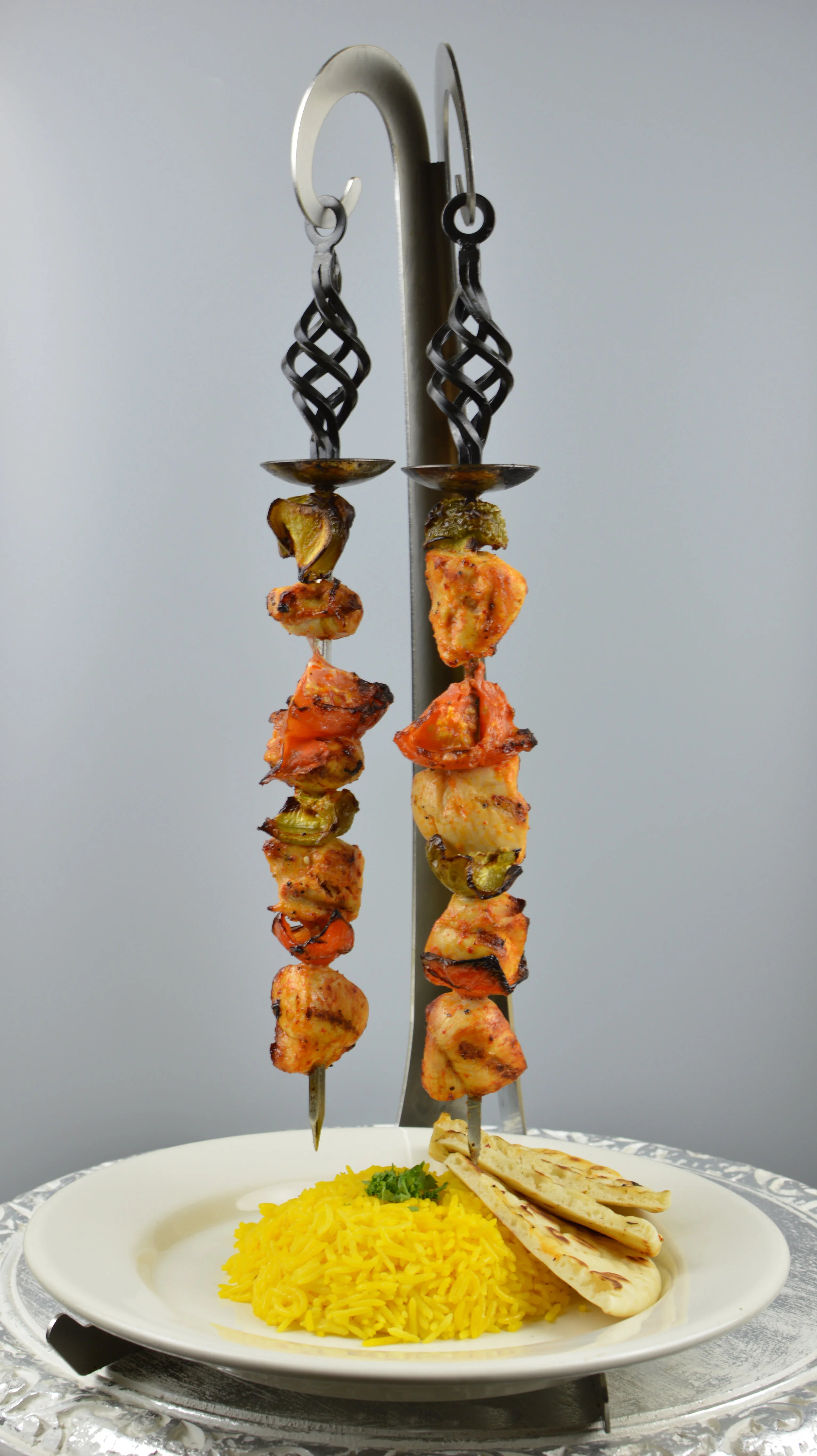 Tavuk Sis (Chicken Shish Kabob) - Two skewers of chargrilled cubes of marinated chicken tender. Served with rice and salad. $12.95