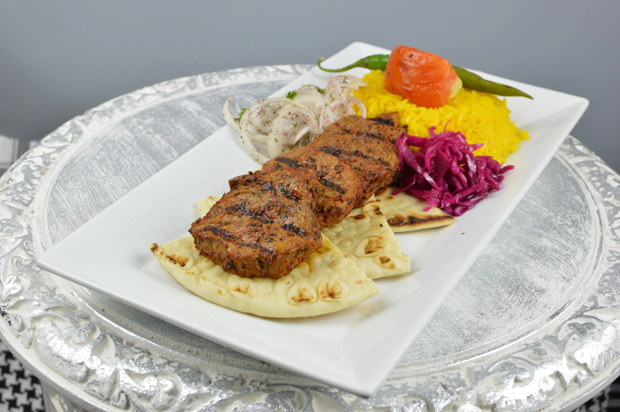 Bonfile Kabob (Filet Mignon) - Marinated and chargrilled beef filet mignons. Served with rice and salad. $16.95
