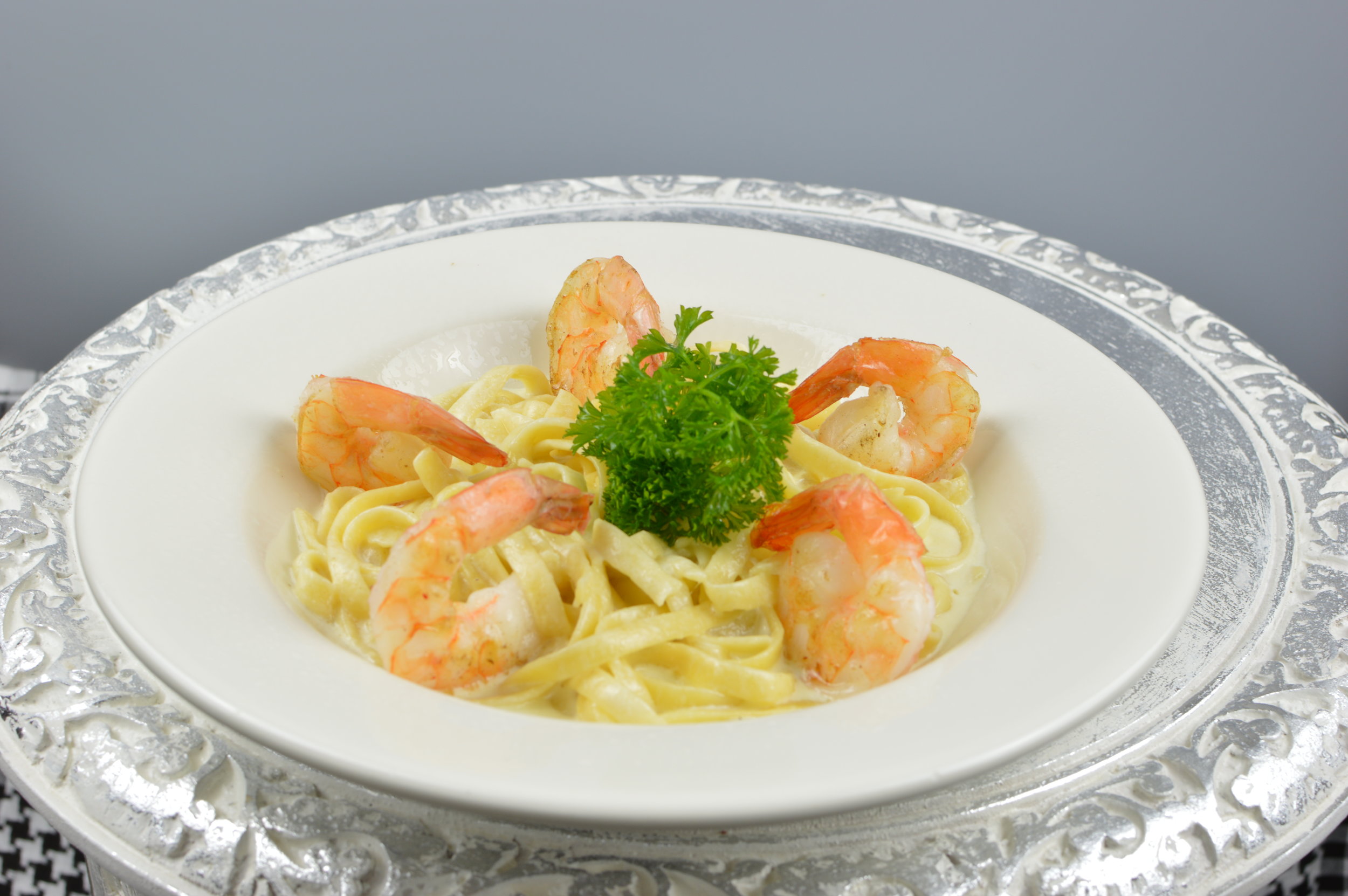 Pasta - Parmesan cheese and Alfredo or Cajun cream sauce over fettucine pasta. $7.95 Add chicken (+ $4) Add Shrimp (+ $6)