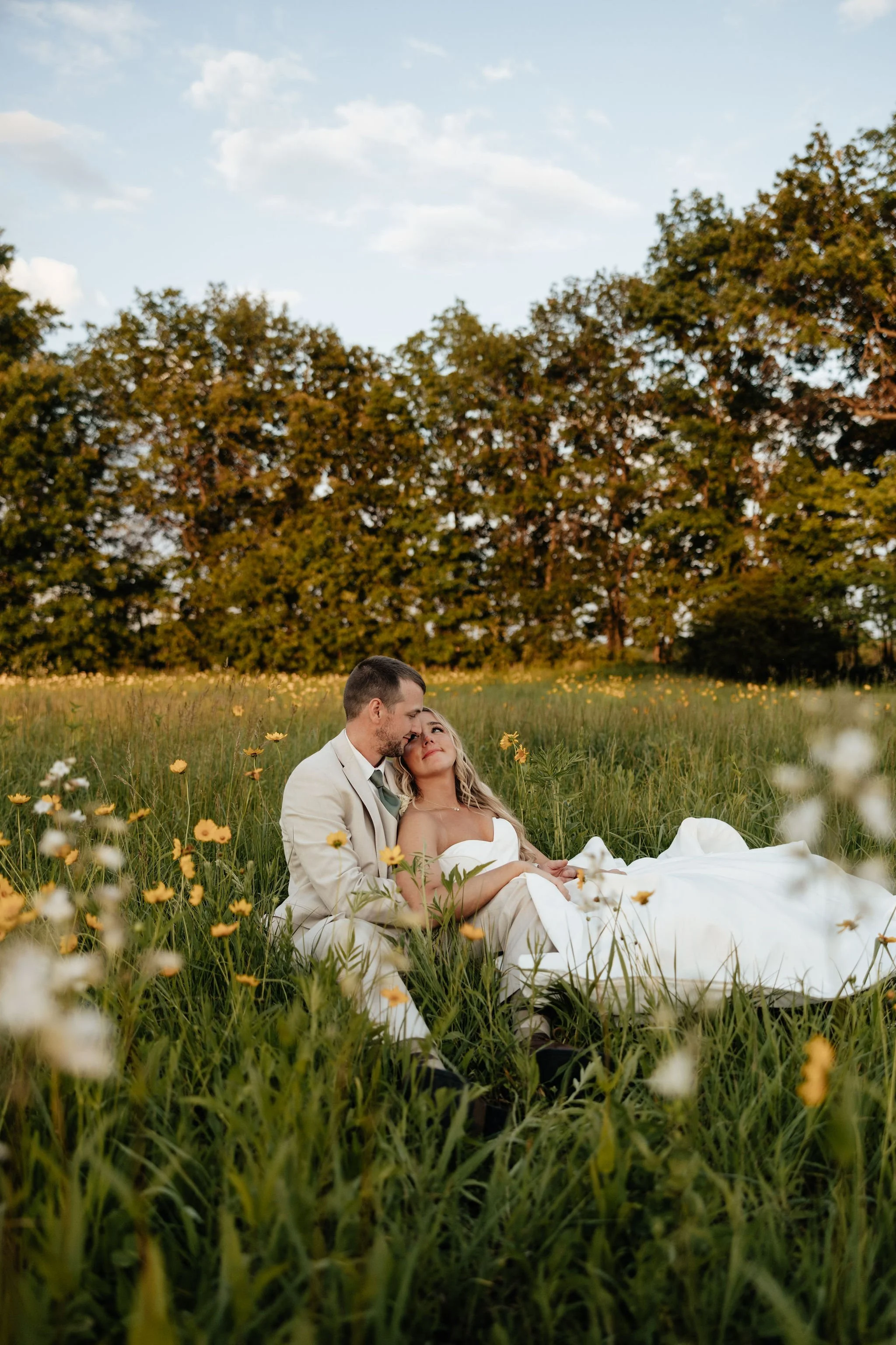 Midwest bride and groom sitting outside