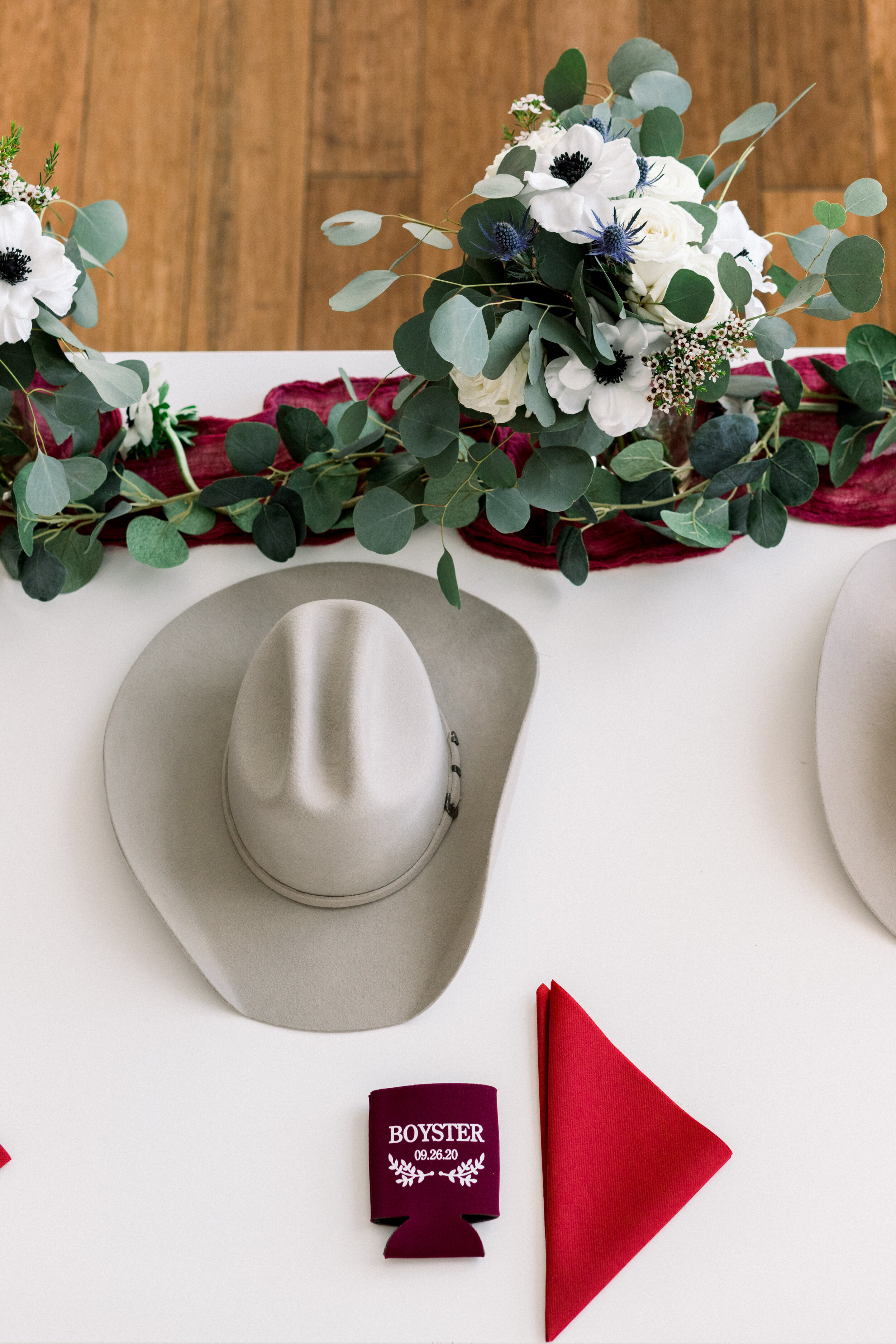 Kelsi Kliethermes Photography cowboy wedding koozie favors hat headtable.jpg